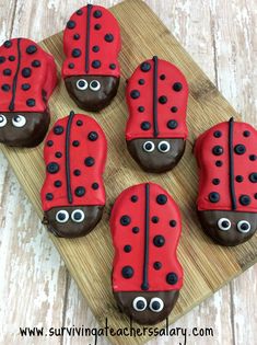 ladybug cookies are arranged on a cutting board