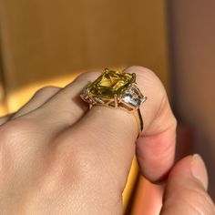 Effy designer, estate, 14KT yellow gold emerald-cut, large citrine and trapezoid white topaz ring. Size 7 Can be resized for an additional fee Weight: 5 grams Citrine stone measures: 14mm x 12mm Trapezoid white topaz measures 9.5mm x 6mm x6mm Stamped 14K & hallmarked Effy Very Good Condition Yellow Topaz Emerald-cut Ring In Fine Jewelry, Yellow Emerald Cut Topaz Ring In Fine Jewelry Style, Yellow Emerald-cut Topaz Ring Fine Jewelry, Yellow Emerald-cut Topaz Ring, Luxury Citrine Topaz Ring With Emerald Cut, Gold Square Cut Emerald Ring With Gemstone, Yellow Topaz Ring With Emerald Cut And Prong Setting, Yellow Topaz Ring With Prong Setting, Emerald Cut, Yellow Emerald Cut Gemstone Jewelry