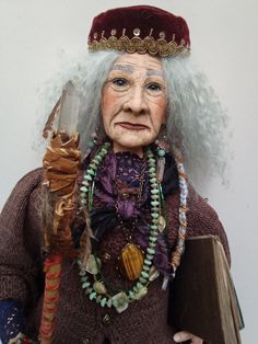 an old woman with white hair holding a book