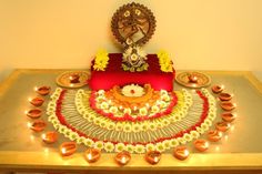 a decorated table with candles and decorations on it for diwaling or decorating