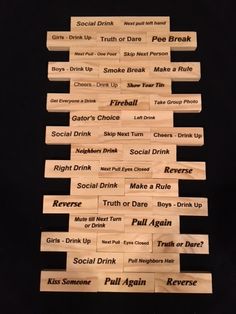 several pieces of wood that have different types of words on them, all stacked together