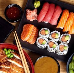 sushi platter with chopsticks and various types of sushi on it