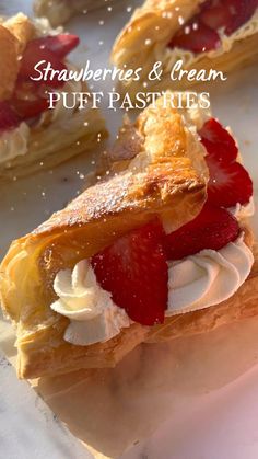 strawberries and cream puff pastries on a plate