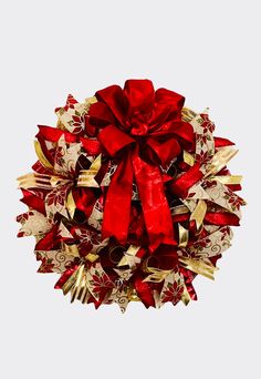 a red and gold christmas wreath with bows