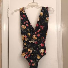 Gorgeous, Feminine One-Piece Women’s Swimsuits. Black With Floral Pattern. Back Criss-Crosses. New With Tags **Open To All Fair Offers** Poolside Stretch Floral Print Bodysuit, Poolside Stretch Bodysuit With Floral Print, Fitted Floral Print One-piece, Stretch Floral Print Bodysuit For Pool, Sleeveless Floral Print Bodysuit For Party, Floral Print V-neck Bodysuit For Poolside, Beachwear Floral Print V-neck Bodysuit, Floral Print V-neck Poolside Bodysuit, Sleeveless Floral Print Bodysuit For Pool