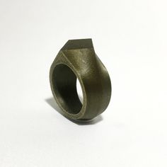 This is an elegant ring with a diamond shape printed in PLA plastic, silver, gold plated steel or gold 14k. It is designed to be unisex. Looks great in any color for women. It is perfect for men when printed in dark colors such as black, bronze (see photos), silver or in stainless steel. Includes a free unique jewelry stand to showcase the ring.  D I A M O N D R I N G S H O R T :: unisex :: If a plastic ring would have the personality of a diamond how it would be? I think it would be bold, mysterious and elegant. In metals looks glam!! 3d printed in a tough biodegradable plastic derived from renewable resources. Every product in this store is printed with the best FDM 3d printers on the market today for better print quality. On top of that, small prints like jewelry, are printed in the hig Wedding Casual, Biodegradable Plastic, Plastic Ring, 3d Printers, Ring For Men, Rings Cool, Jewelry Stand, Elegant Ring, Diamond Shape