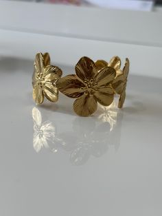 Beautiful 18k Gold plated  Cuff flower  bracelet. Perfect statement piece for any occasion Gold Flower Bangle, Gold Metal Bracelet Gift For Her, Gold Metal Bracelets As A Gift For Her, Elegant Flower Decorated Bracelet, Elegant Floral Decorated Bracelet Jewelry, Delicate Gold Bangle Cuff Bracelet, Gold Plated Flower Shaped Jewelry, Gold Plated Flower Jewelry In Gold Color, Gold Plated Flower Shaped Jewelry In Gold