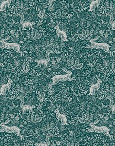 a green and white wallpaper with deers in the woods on it's side