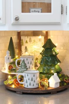 a kitchen counter with christmas decorations and coffee mugs