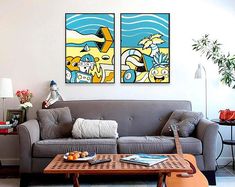 a living room with two paintings on the wall