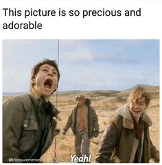 two young men laughing in the middle of an open field with text that reads, this picture is so precious and adorable yeah