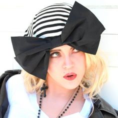 "Borderline Style Slouchy Beret Hat- Black & White Striped Knit with Black Bow a 1\" elastic soft band inside. One size fits all and will fit up to a 23\" head size or customized size upon request. All of Bella Starr hats are made and designed from my original patterns. Caring for your hat: Hand wash and hand dry A glamorous, hand-made, stylish hat, that complements your choice in fashion and defines your individual style. Accessorizing with a Bella Starr hat should always be playful, glamor Retro Black Beret For Winter, Black Cloche Hat One Size, Black Cloche Hat, One Size Fits Most, Black Flat Cap For Spring, Black Brimmed Mini Hat One Size, Black Brimmed Mini Hat, One Size, Black Spring Beret Cap, Spring Black Beret Cap, Retro Black Hat For Spring