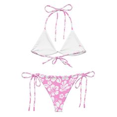 Indulge in the luxurious and exclusive style of our White Hawaiian Flowers on Pink String Bikini. This beautiful string bikini set is not only comfortable, but it also offers double-layering and UPF 50+ protection. Customize the straps to your liking and get ready to turn heads at the beach! Made from soft recycled polyester, this bikini is both stylish and sustainable. • Soft and stretchy material with UPF 50+• Sizes up to 6XL• Bikini top comes with removable padding for comfort• Multiple ways Beach String Swimwear With Adjustable Straps, Beach Swimwear With Adjustable Straps, Beach Swimwear With Adjustable String Straps, Beach Swimwear With Adjustable Straps And String Shape, Pink String Swimwear For Beach Season, Pink String Swimwear For Summer, Pink String Swimwear For Sunbathing, Pink Adjustable Strappy Swimwear, Adjustable Pink Beachy Swimwear