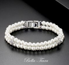 BEST SELLER Simple elegance, timeless 2 row off white pearl bracelet 7" inch standard size, 1/2" wide *Note processing time is not shipping time, our regular Free shipping takes approx. 5-6 days to receive after shipped. With rush processing your order is expedited and you will also be upgraded to priority mail approx 2-3 days to arrive once shippedExpress shipping is available always contact us if needed within 2-3 days. Formal White Pearl Embellished Bracelets, Formal White Pearl Bracelets, White Pearl Bracelet For Mother Of The Bride, White Pearl Embellished Bracelet For Anniversary, Cream Pearl Bracelet For Wedding, Elegant Cream Pearl Bracelet, Elegant Cream Pearl Bracelet For Wedding, Wedding Pearl Bracelet, Pearl Bracelet Wedding