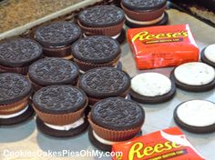 oreo cookies are lined up on the counter next to each other and some candy