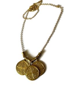 Triple Byzantine Brass Token Necklace with conical bead accents on 14K gold-filled chain.  This is a really unique and fun necklace. Bordering between chunky and simple it is easy to wear with most anything.  Please contact me with any questions. If you require specific measurements, please don't hesitate to ask.  I hope you love your item(s) as much as I loved making it. Please don't hesitate to reach out to me if you have any special requests or alterations. I am happy to make changes to piece Gold Brass Necklaces For Blessing, Gold Brass Necklace For Blessing, Gold Brass Necklace For Blessings, Bohemian Gold Charm Necklaces For Good Luck, Bohemian Gold Charm Necklace For Good Luck, Nickel-free Gold Brass Charm Necklaces, Gold Nickel-free Charm Necklaces For Good Luck, Gold Nickel-free Charm Necklace For Good Luck, Gold Good Luck Charm Necklace Nickel Free