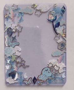 an image of a glass frame with flowers and butterflies