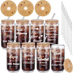 six jars with wooden lids and spoons in them, each filled with different types of food