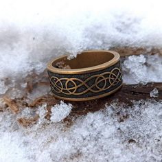 a ring sitting on top of snow covered ground