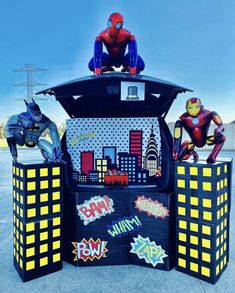 an outdoor display with spiderman and other decorations