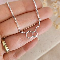 "Serotonin necklace, science jewelry, science necklace 925 Sterling Silver This necklace is made of solid 925 Sterling Silver and reproduces the molecular structure of Serotonin Neurotransmitter. Serotonin is called \"the molecule of happiness\": it is responsible for control of the mood and for the sensation of happiness. Perfect for everyday wear, it could be the perfect gift for your science-addicted friend, for her or for you! It is possible to customize it with an initial or a birthstone - Science Necklace, Serotonin Necklace, Serotonin Molecule, Molecule Necklace, Science Jewelry, Molecular Structure, Personalized Pendant, Gold Filled Jewelry, Necklace Silver