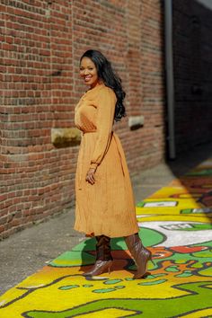 Pleated Camel Dress This pleated camel dress is a must have! Perfect for brunch, work or even a night out. You can pair with your favorite boots or sandals depending the season. This dress is a great transitional piece. Details: Gathered neck and wrists Long sleeves Comes w/ belt Comfortable Model is wearing a size small Fits true to size for most Model Measurements: Size: Medium • Height: 5'6 • Bust: 34 • Waist: 30 • Hips: 41.5 •