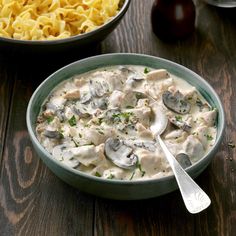 a bowl of pasta with mushrooms and cheese