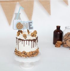 a birthday cake with cookies and chocolate on top