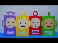 four small bags with faces on them and the words happy birthday written on each bag