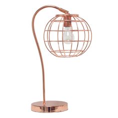 a copper colored lamp with a wire ball on the base and a light bulb attached to it