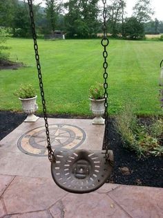 a swing that is sitting in the grass