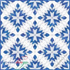 a blue and white quilt with an intricate design on the front, featuring snowflakes