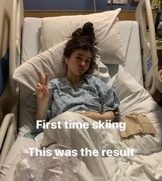 a woman laying in a hospital bed with the words first time skiing this was the result