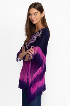 Beautifully adorned with intricate placement embroidery, the Alani Ombre Poncho is washed in a vibrant shade of violet. Crafted from 100% silk and featuring a rounded collar and a dropped shoulder line, this poncho is finished with delicate fringe at the hemlines. Pair with fitted jeans and trendy ankle boots for a night out with friends. Johnny Was Women's Alani Ombre Poncho in Violet Indigo Purple, Size Large/XL, 100% Silk Placement Embroidery, Indigo Purple, Fitted Jeans, Shades Of Violet, Dresses Boho, Women's Outfits, Boho Chic Outfits, Embroidered Jeans, Johnny Was