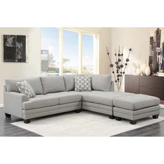 a living room scene with focus on the sectional sofa