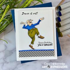 a handmade birthday card with an image of a man in blue shirt and green pants