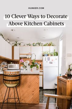 a kitchen with white cabinets and wooden floors is featured in the article 10 clever ways to decorate above kitchen cabinets