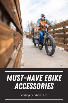 a man riding on the back of a motorcycle down a wooden bridge with text overlay reading must - have ebike accessories