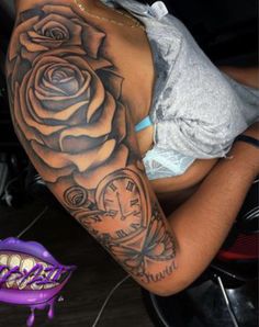 a woman with a rose tattoo on her arm