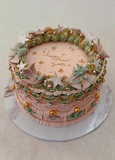 a three layer cake decorated with stars and ribbons