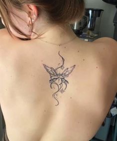 a woman with a tattoo on her back