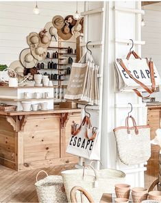 the interior of a store with baskets and hats hanging on the wall, along with other items