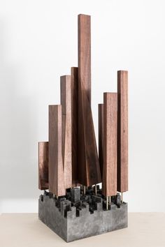 the sculpture is made out of wood and metal