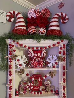 the shelf is decorated with candy canes and candies