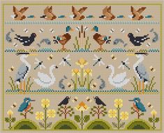 a cross stitch pattern with birds and flowers