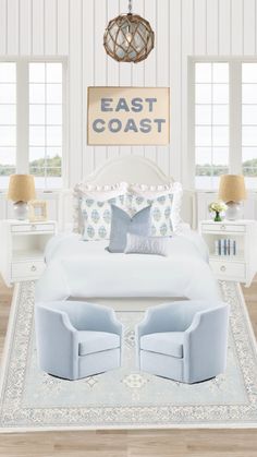 a bedroom with white walls and blue furniture in the center, along with an east coast sign on the wall