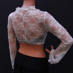 "Cream lace top is a feminine staple for all seasons. Slip on this cropped cover up to give a chic cozy touch to everything from skirts to sundress, jeans, and shorts. This top has long sleeves and a tie fastening the front. 100% lace. Mannequin is 177cm/ 5'10\" and is wearing a size small SIZE XS (US S 0-2, UK 6-8, Italian 36-38, French 32-34) Bust: fits bust around 32-33 Waist: fits waist around 24-25 Hips: fits hips around 35-36 SIZE S (US S 4-6, UK 10-12, Italian 40-42, French 36-38) Bust: f Cream Lace Top, Plus Size Top, Cream Lace, Yoga Tops, Womens Blouses, Long Blouse, Wrap Top, Sundress, Lace Top