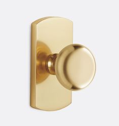 a golden door handle with a round knob on an isolated white background for use in interior or exterior decor