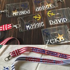 four different lanyards with name tags attached to them and one has a keychain