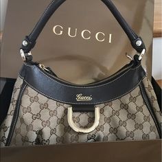 Authentic Gucci Hobo Bag W/ D Ring Gold. Gently Used. Minor Scuffs On Four Corners Shown In Pic. Other Than That, It's In Great Condition, Clean Inside, Has Zipper. Handle Is Still Great Shape. No Trades. I Don't Have The Dust Bag But Will Come In The Box That Came With It As Shown. Only Accepting Offers Within This Range. Posh Will Authenticate Items Over 500 For Free! Gucci Hobo Bag, Yellow Purses, Purple Bag, Crystal Bags, Gucci Monogram, Gucci Tote, Vintage Leather Bag, Large Handbags, Canvas Shoulder Bag